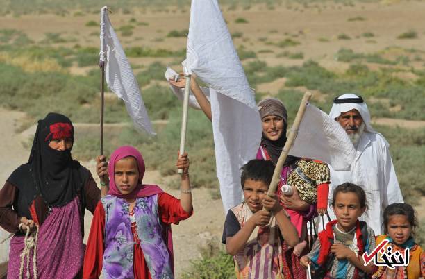 تصاویر : فرار یک خانواده از دست داعش با پرچم سفید